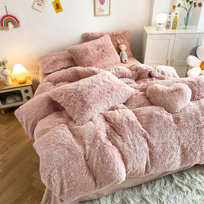 Left angle view of the VibeCore Cloud 9 Bedding Set in the color Rose, featuring ultra-soft fleece fabric for unmatched comfort and warmth. This cozy bedding set adds a touch of luxury and style to your bedroom or dorm, perfect for relaxing and unwinding after a long, cold day.