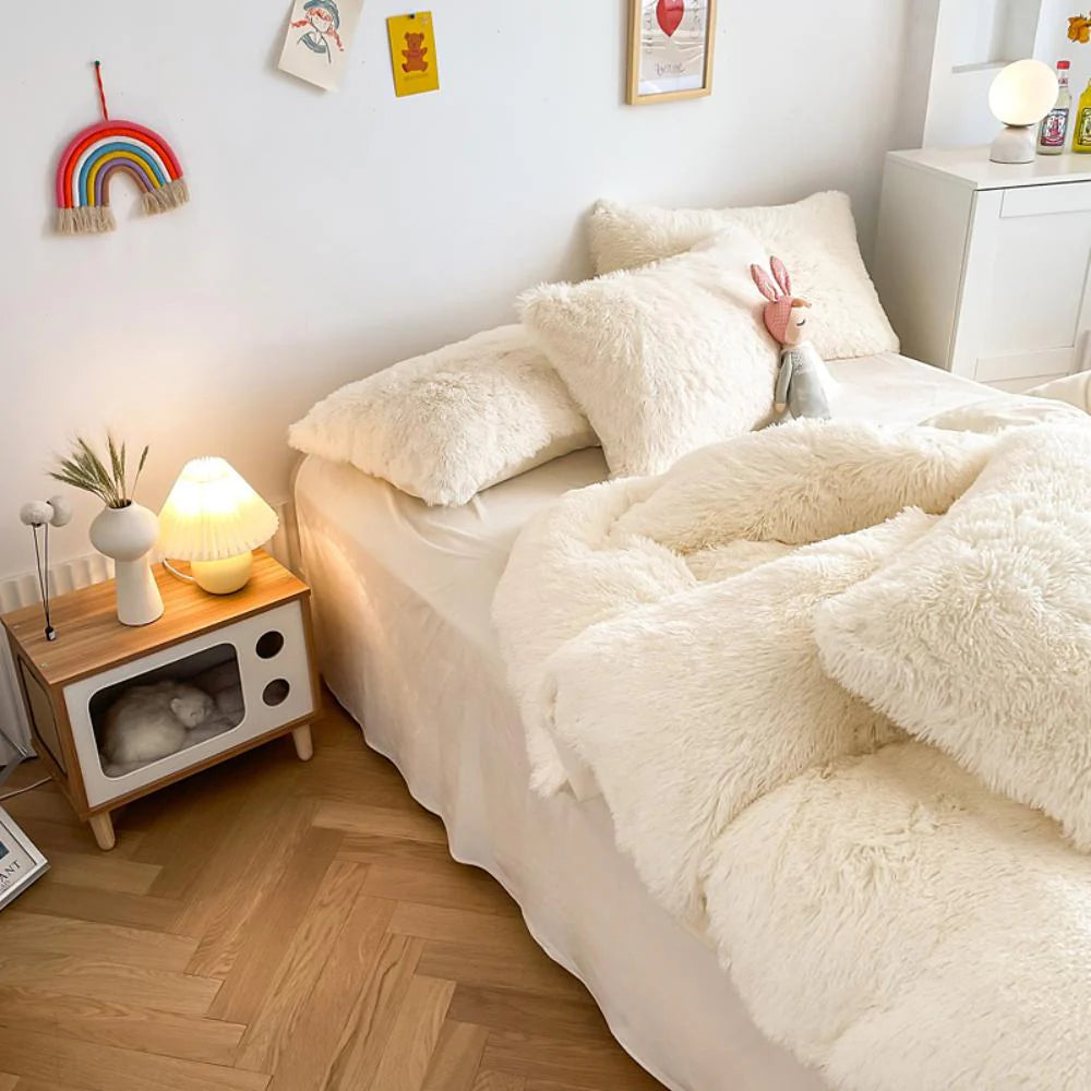 Left angle view of the VibeCore Cloud 9 Bedding Set in the color White, featuring ultra-soft fleece fabric for unmatched comfort and warmth. This cozy bedding set adds a touch of luxury and style to your bedroom or dorm, perfect for relaxing and unwinding after a long, cold day.