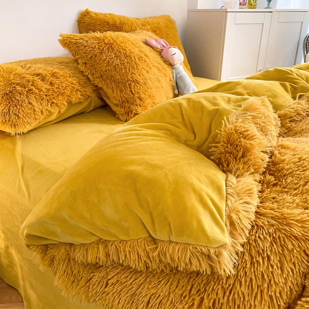 Close-up of the duvet cover from the VibeCore Cloud 9 Bedding Set in the color Mustard Yellow, featuring ultra-soft fleece fabric for ultimate comfort and cozy luxury. Perfect for adding warmth, style, and a plush feel to your bedroom or dorm, ideal for sleeping or relaxing.