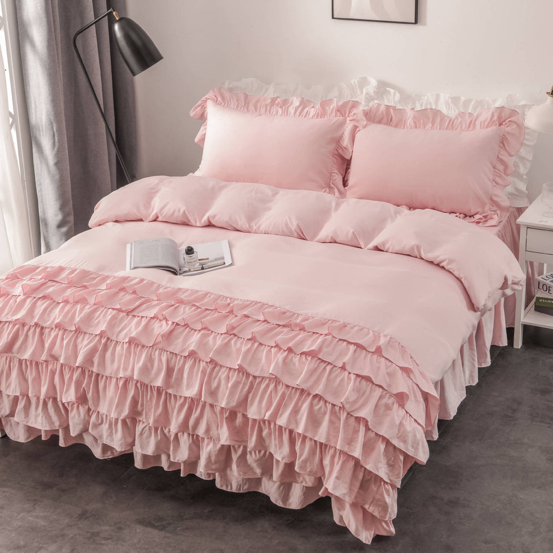 Aerial side view of the VibeCore Aesthetic Elegant Ruffles Duvet Cover Set in baby pink, featuring delicate ruffle details and soft, breathable fabric. A dreamy, modern addition to any bedroom or dorm, offering cozy comfort and an inviting aesthetic.