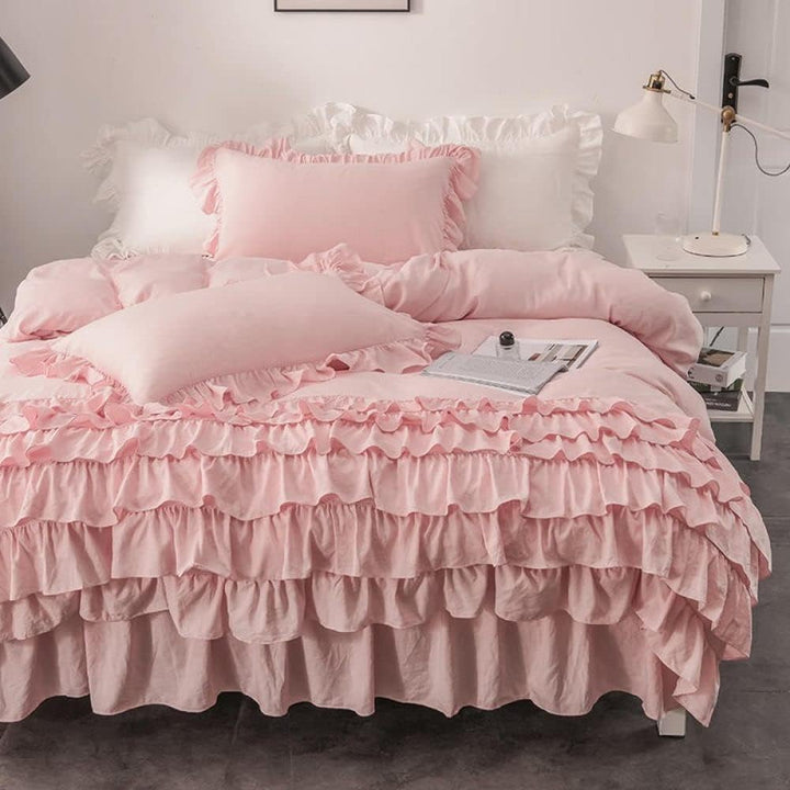 Front view of the VibeCore Aesthetic Elegant Ruffles Duvet Cover Set in baby pink, featuring soft, delicate ruffles and smooth, breathable fabric. This charming set brings a cozy, feminine touch to any bedroom or dorm, combining elegance with comfort.
