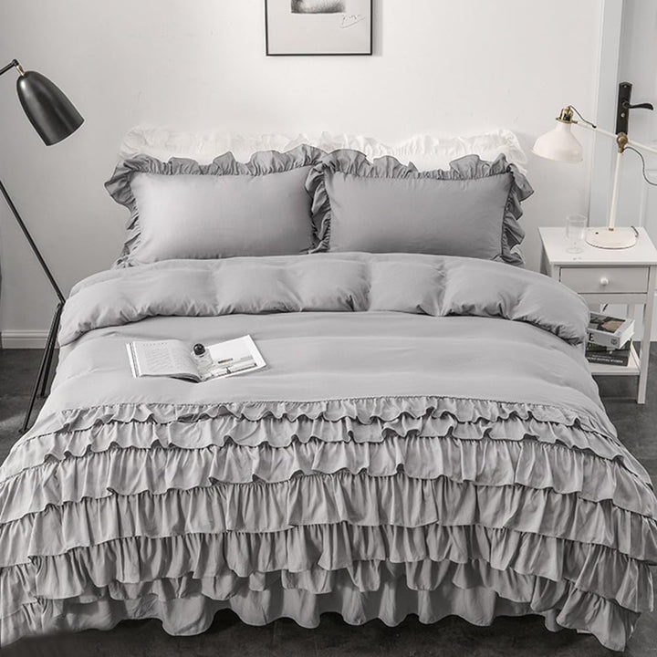 Aerial view of the VibeCore Aesthetic Elegant Ruffles Duvet Cover Set in gray, showcasing the delicate ruffle details and soft, breathable fabric. This dreamy, modern set adds a cozy and chic touch to any bedroom or dorm, perfect for ultimate comfort and style.