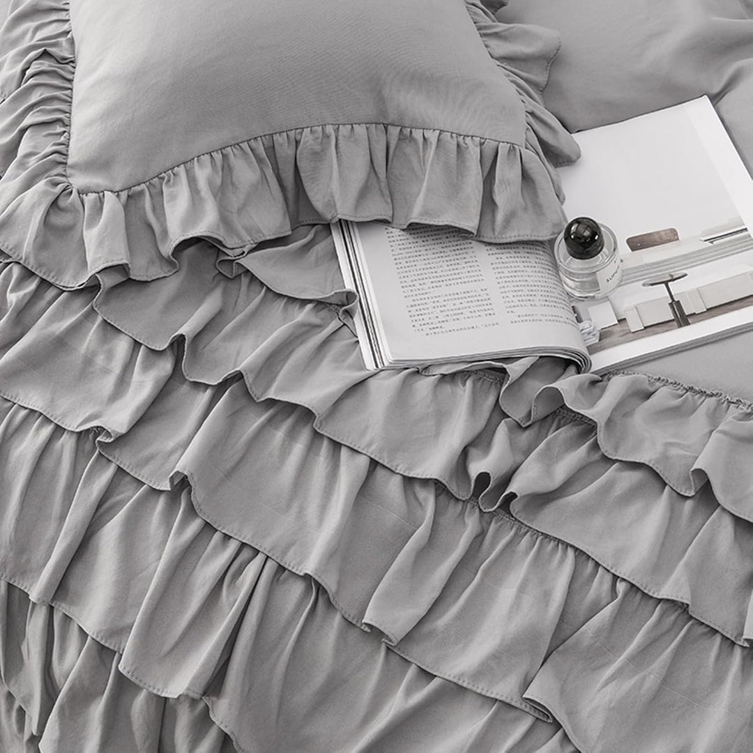 Close-up view of the VibeCore Aesthetic Elegant Ruffles Duvet Cover Set in gray, highlighting the soft ruffle details and the smooth, breathable fabric. The perfect blend of cozy comfort and chic, modern style for any bedroom or dorm.