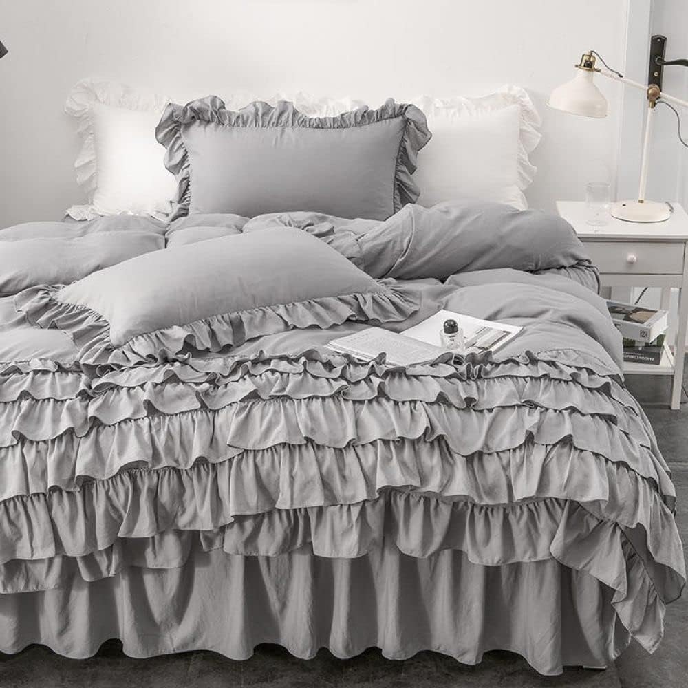 Front view of the VibeCore Aesthetic Elegant Ruffles Duvet Cover Set in gray, featuring soft, delicate ruffles and smooth, breathable fabric. This charming set brings a cozy, feminine touch to any bedroom or dorm, combining elegance with comfort.