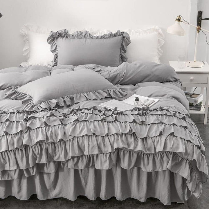 Front view of the VibeCore Aesthetic Elegant Ruffles Duvet Cover Set in gray, featuring soft, delicate ruffles and smooth, breathable fabric. This charming set brings a cozy, feminine touch to any bedroom or dorm, combining elegance with comfort.