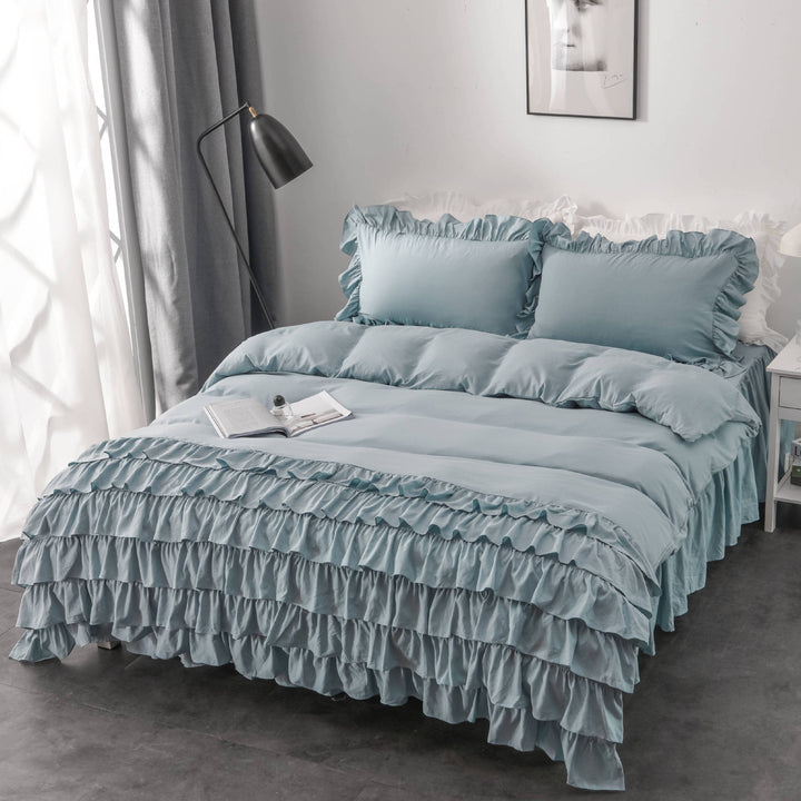 Aerial side view of the VibeCore Aesthetic Elegant Ruffles Duvet Cover Set in pastel blue, featuring delicate ruffle details and soft, breathable fabric. A dreamy, modern addition to any bedroom or dorm, offering cozy comfort and an inviting aesthetic.