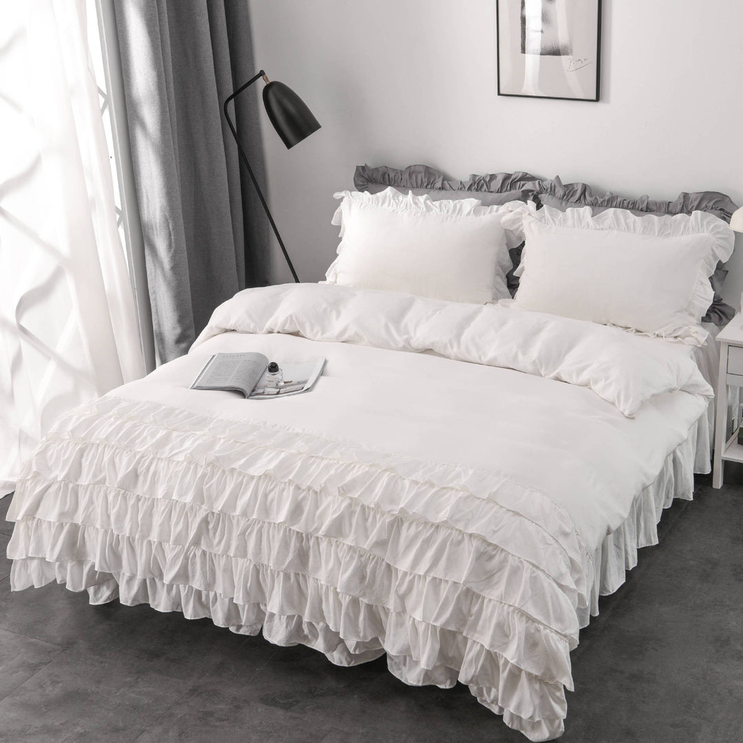 Aerial side view of the VibeCore Aesthetic Elegant Ruffles Duvet Cover Set in white, featuring delicate ruffle details and soft, breathable fabric. A dreamy, modern addition to any bedroom or dorm, offering cozy comfort and an inviting aesthetic.
