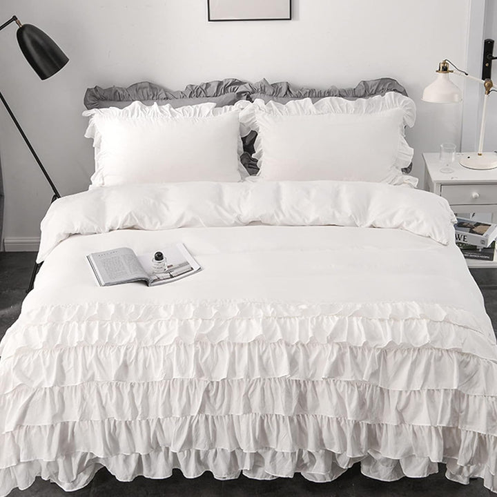 Aerial view of the VibeCore Aesthetic Elegant Ruffles Duvet Cover Set in white, showcasing the delicate ruffle details and soft, breathable fabric. This dreamy, modern set adds a cozy and chic touch to any bedroom or dorm, perfect for ultimate comfort and style.