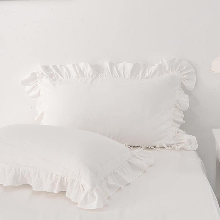 Close-up of the pillowcases from the VibeCore Aesthetic Elegant Ruffles Duvet Cover Set in white, showcasing the soft ruffle details and smooth, breathable fabric. A stylish and cozy accent to elevate any bedroom or dorm decor.