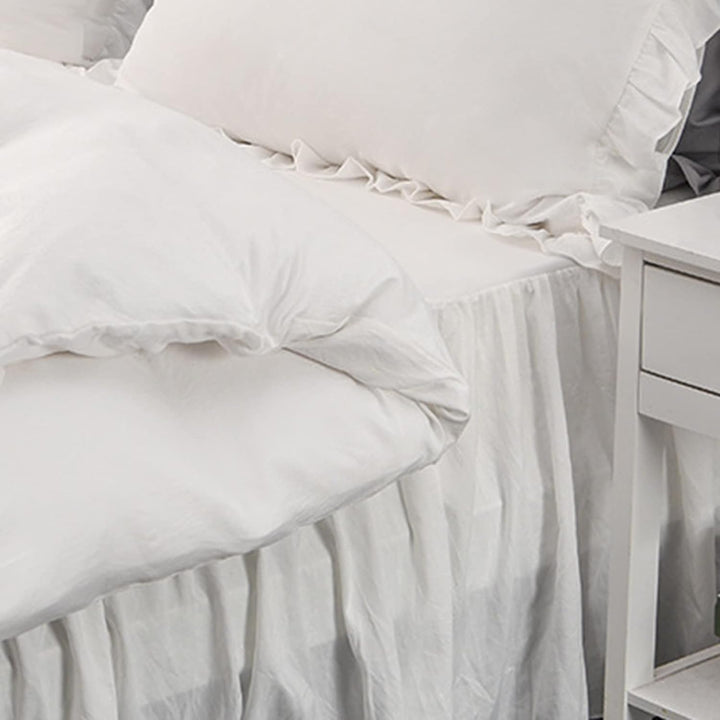 Close-up view of the sheet from the VibeCore Aesthetic Elegant Ruffles Duvet Cover Set in white, featuring the soft, breathable fabric and subtle ruffle accents. A cozy and stylish addition to elevate the comfort and aesthetic of any bedroom or dorm.
