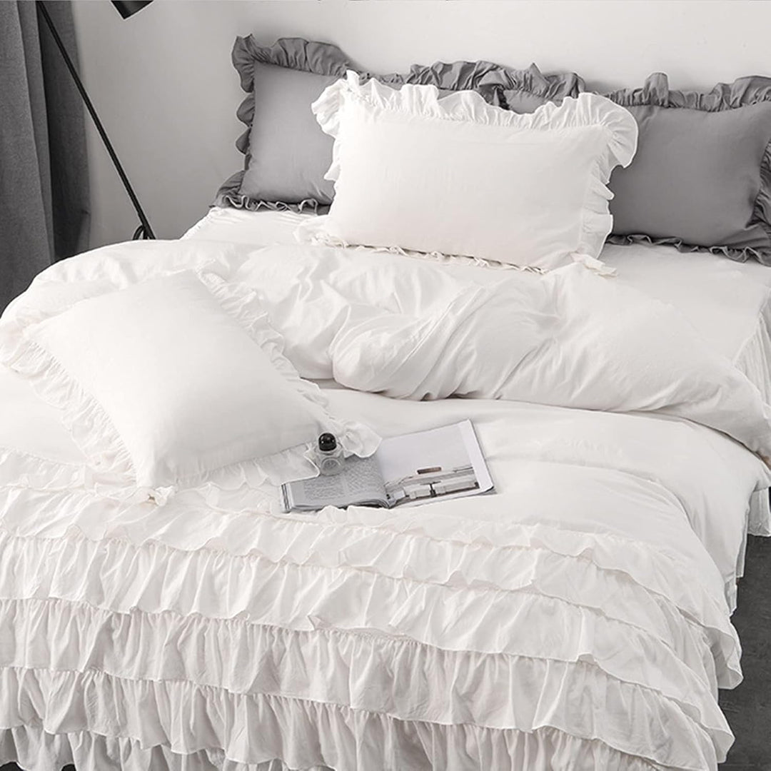Side view of the VibeCore Aesthetic Elegant Ruffles Duvet Cover Set in white, highlighting the soft ruffle details and smooth, breathable fabric. A chic and cozy addition to any bedroom or dorm, offering both comfort and elegant style.