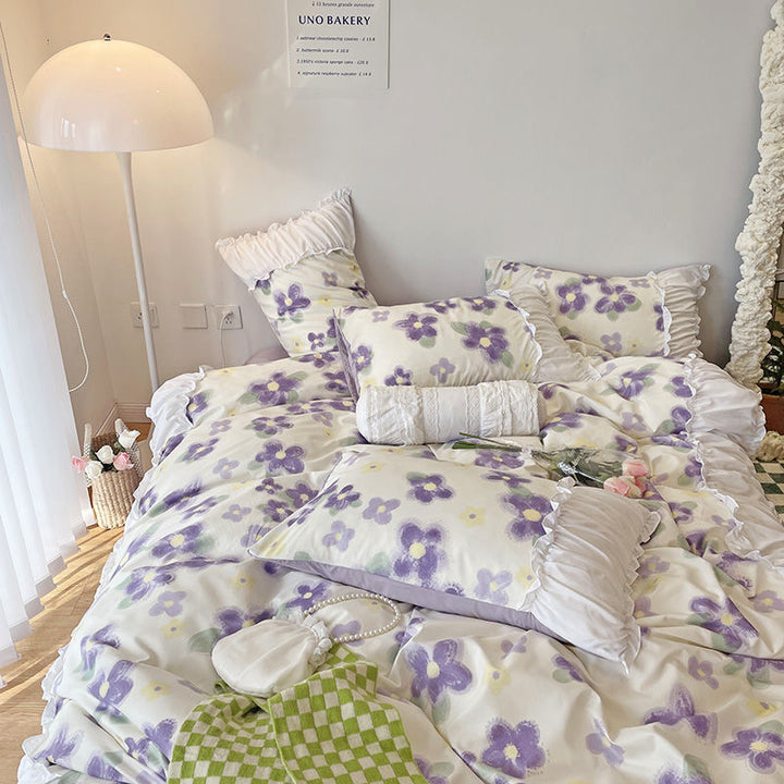 Aerial view of the VibeCore Aesthetic Florals and Ruffles Pleated Edge Duvet Cover Set featuring vibrant iris prints, accented with delicate ruffles and pleated edges for a charming, feminine touch to your bedroom decor.