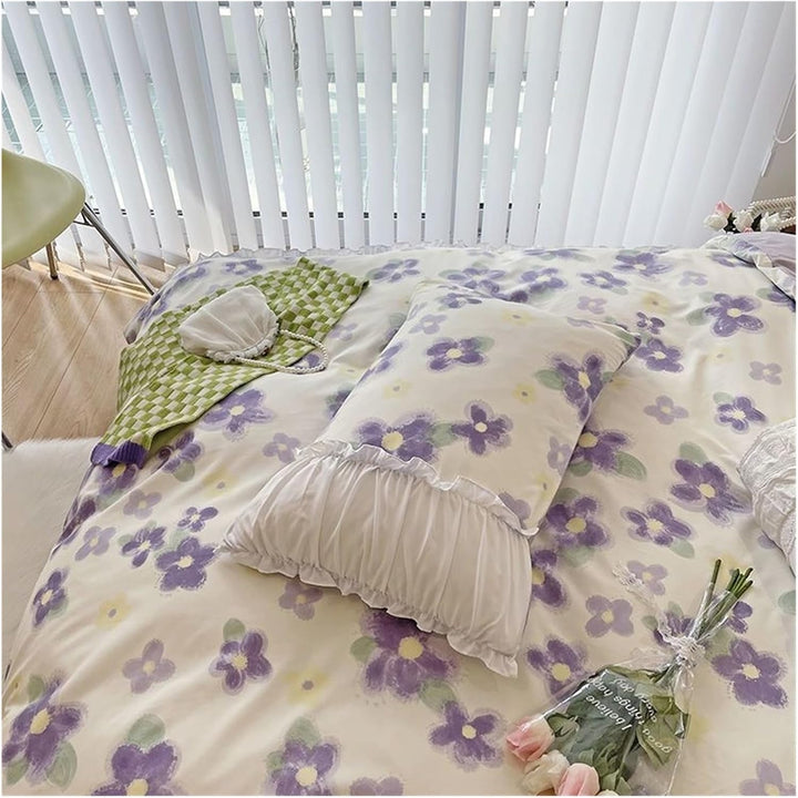 Close-up of the VibeCore Aesthetic Florals and Ruffles Pleated Edge Duvet Cover Set Iris pillowcase, featuring delicate floral patterns and soft ruffled edges, offering a sophisticated and cozy touch to any bedroom decor.