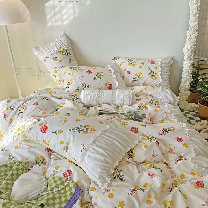 Aerial close-up of the VibeCore Aesthetic Florals and Ruffles Pleated Edge Duvet Cover Set, showcasing the delicate rose floral design and elegant pleated edges for a refined, romantic look.