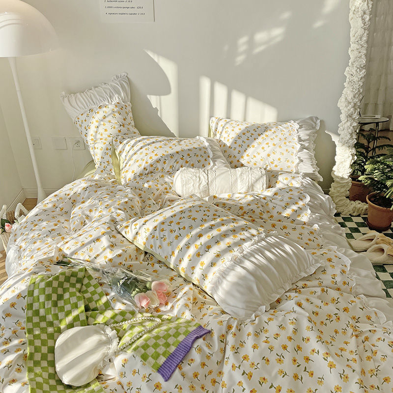 Aerial close-up of the VibeCore Aesthetic Florals and Ruffles Pleated Edge Duvet Cover Set, featuring vibrant yellow daisies with delicate ruffled edges for a soft, feminine aesthetic.