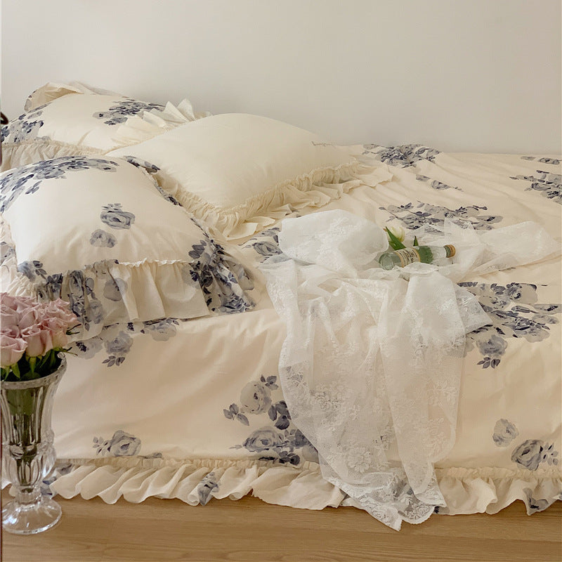 Side view of the VibeCore Aesthetic Flower Ink French Ruffles Duvet Cover Set, showcasing the intricate floral ink design paired with delicate French ruffles, bringing a chic and romantic touch to your bedroom or dorm aesthetic.