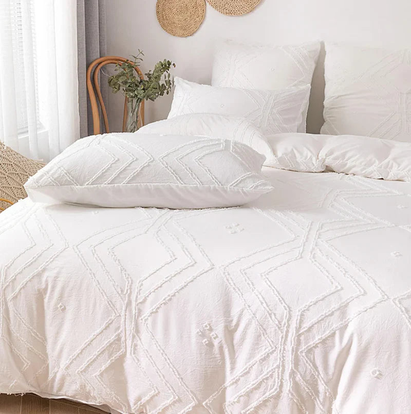Close-up shot of the VibeCore Aesthetic Free Spirit Tufted Duvet Cover Set in white, showcasing the detailed tufted texture and soft, luxurious fabric. This image highlights the intricate design, offering a cozy and boho-inspired aesthetic that brings warmth and style to your bedroom or dorm.