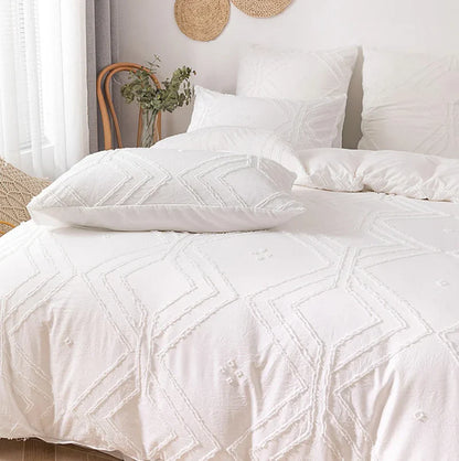 Close-up shot of the VibeCore Aesthetic Free Spirit Tufted Duvet Cover Set in white, showcasing the detailed tufted texture and soft, luxurious fabric. This image highlights the intricate design, offering a cozy and boho-inspired aesthetic that brings warmth and style to your bedroom or dorm.