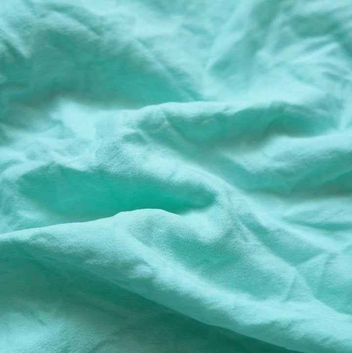 Aerial view of the VibeCore Aesthetic Knot So Ordinary Duvet Cover Set in aqua, featuring a unique knot texture and soft, pastel color that adds a touch of modern charm and cozy elegance to your bedroom or dorm.