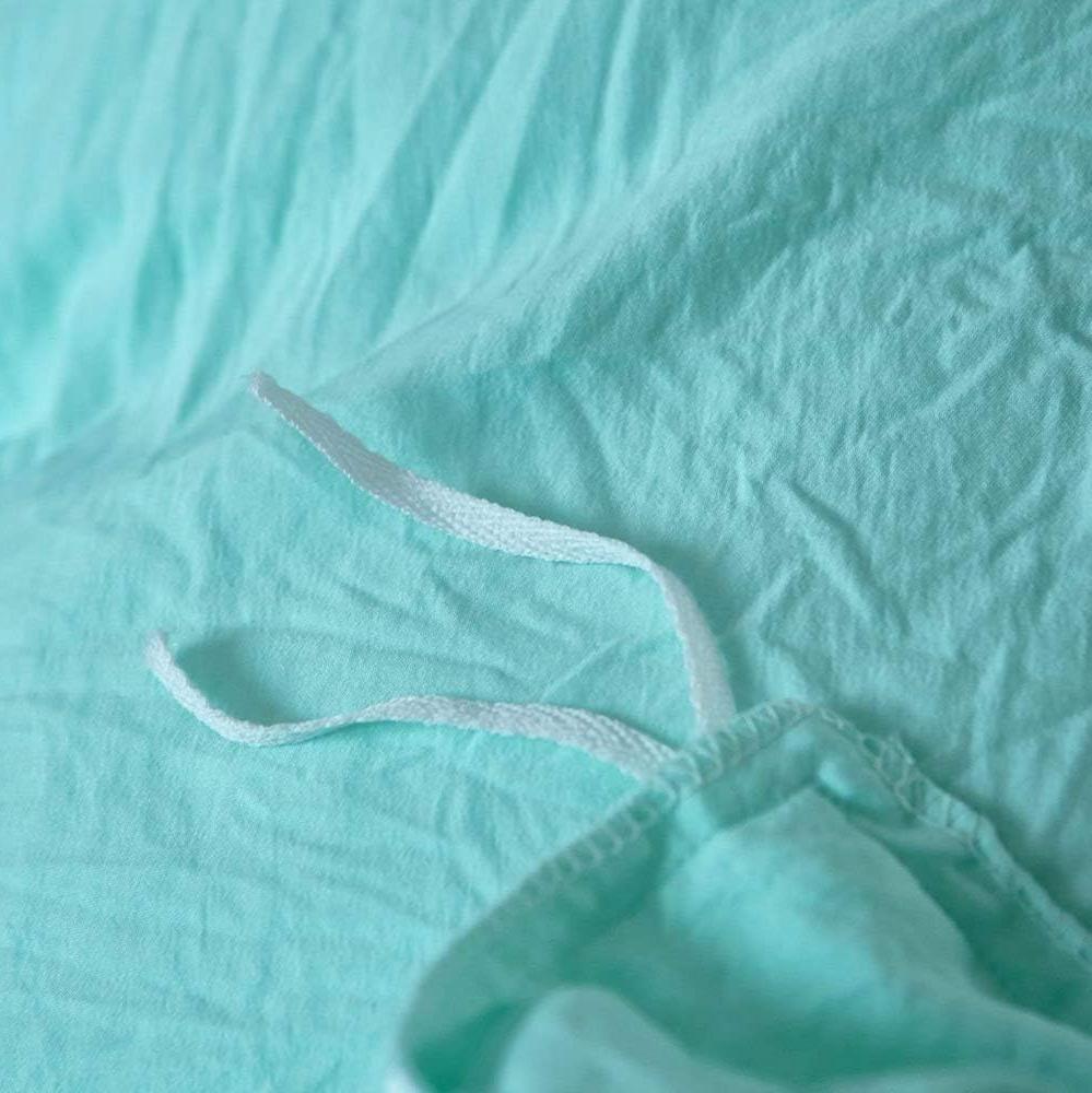 Close-up of the stylish tie feature on the aqua duvet cover from the VibeCore Aesthetic Knot So Ordinary Duvet Cover Set, showcasing the trendy design detail that adds a unique, fashionable touch to your bedding.
