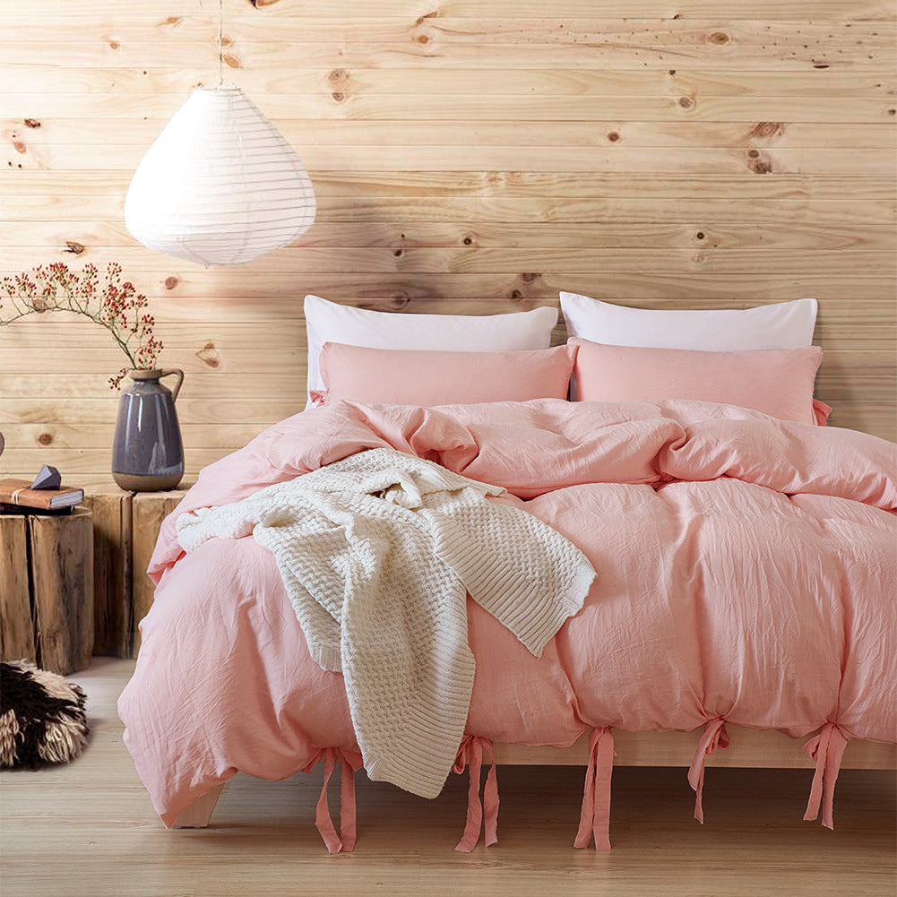 Aerial view of the VibeCore Aesthetic Knot So Ordinary Duvet Cover Set in baby rose, featuring a unique knot texture and soft, pastel color that adds a touch of modern charm and cozy elegance to your bedroom or dorm.