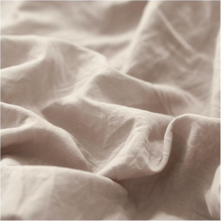 Close-up of the VibeCore Aesthetic Knot So Ordinary Duvet Cover Set in beige, showcasing the soft and textured material and vibrant pastel color, adding a cozy and stylish touch to your bedding.