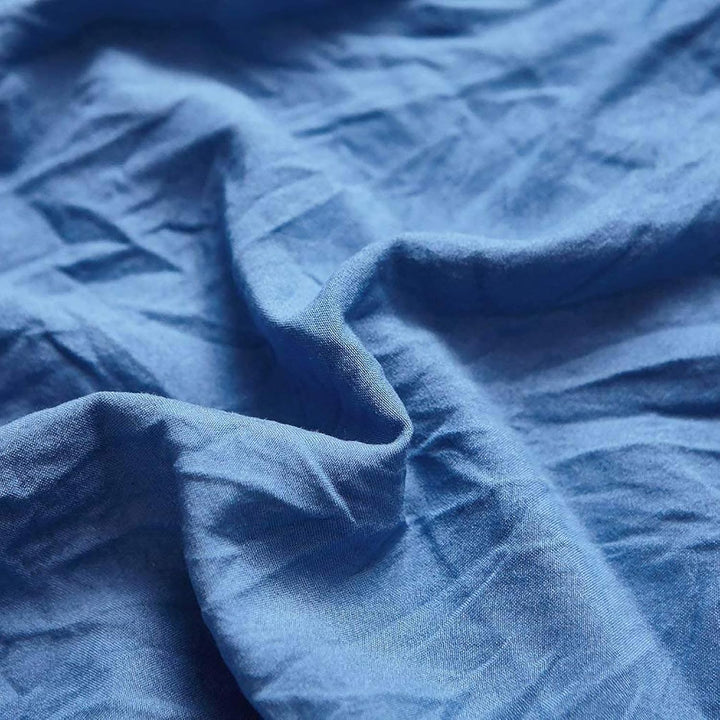 Close-up of the VibeCore Aesthetic Knot So Ordinary Duvet Cover Set in blue, showcasing the soft and textured material and vibrant pastel color, adding a cozy and stylish touch to your bedding.