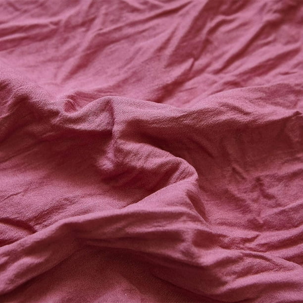 Close-up of the VibeCore Aesthetic Knot So Ordinary Duvet Cover Set in dusty rose, showcasing the soft and textured material and vibrant pastel color, adding a cozy and stylish touch to your bedding.