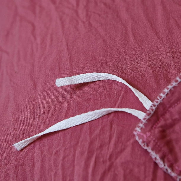 Close-up of the stylish tie feature on the dusty rose duvet cover from the VibeCore Aesthetic Knot So Ordinary Duvet Cover Set, showcasing the trendy design detail that adds a unique, fashionable touch to your bedding.