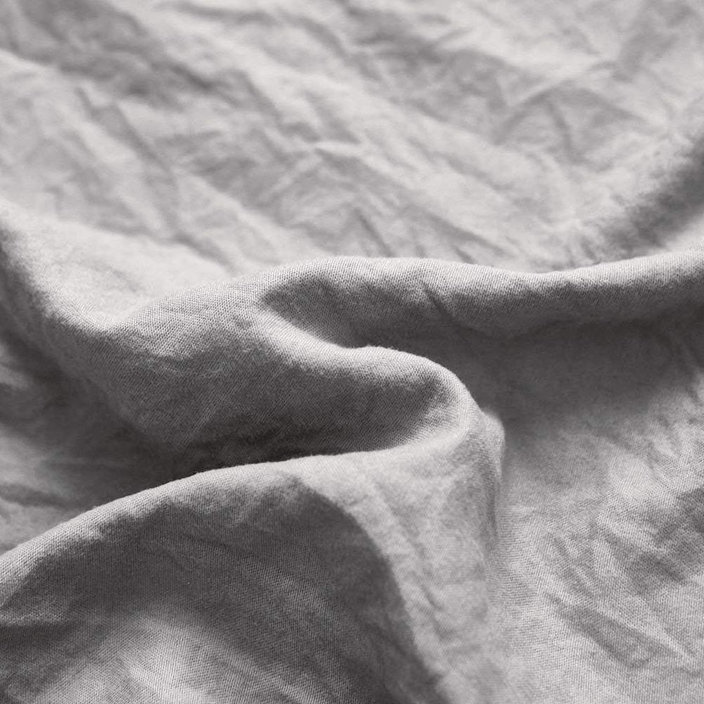 Close-up of the VibeCore Aesthetic Knot So Ordinary Duvet Cover Set in light gray, showcasing the soft and textured material and vibrant pastel color, adding a cozy and stylish touch to your bedding.
