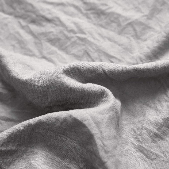 Close-up of the VibeCore Aesthetic Knot So Ordinary Duvet Cover Set in light gray, showcasing the soft and textured material and vibrant pastel color, adding a cozy and stylish touch to your bedding.