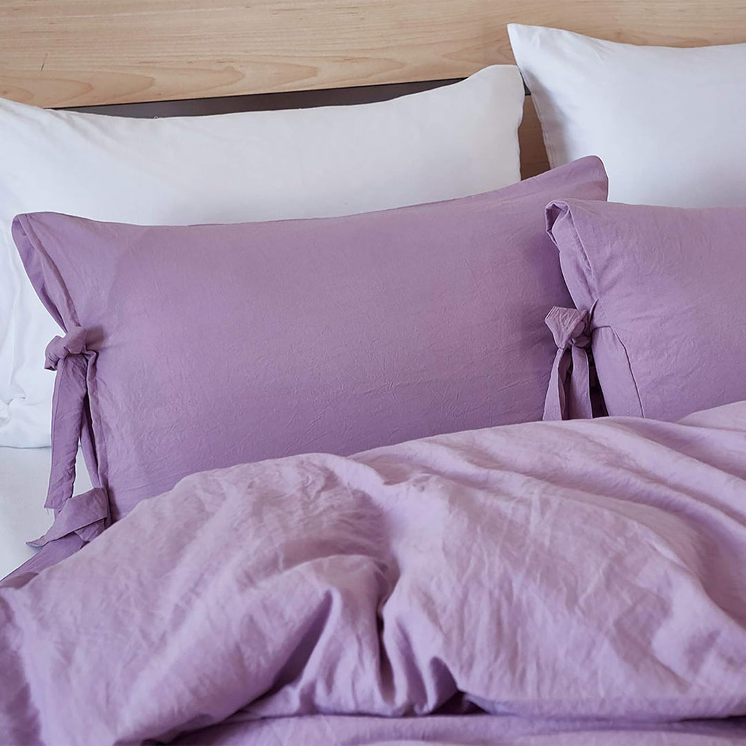 Close-up of the lilac pillowcase from the VibeCore Aesthetic Knot So Ordinary Duvet Cover Set, featuring a soft, textured fabric with unique knot edge detailing for an added cozy, stylish vibe to your bedroom or dorm. 