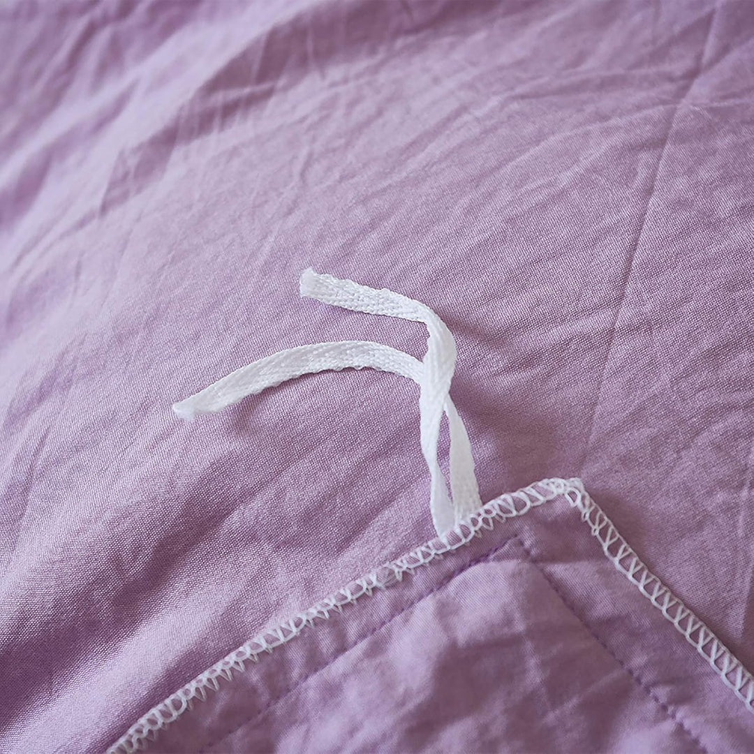 Close-up of the stylish tie feature on the lilac duvet cover from the VibeCore Aesthetic Knot So Ordinary Duvet Cover Set, showcasing the trendy design detail that adds a unique, fashionable touch to your bedding.