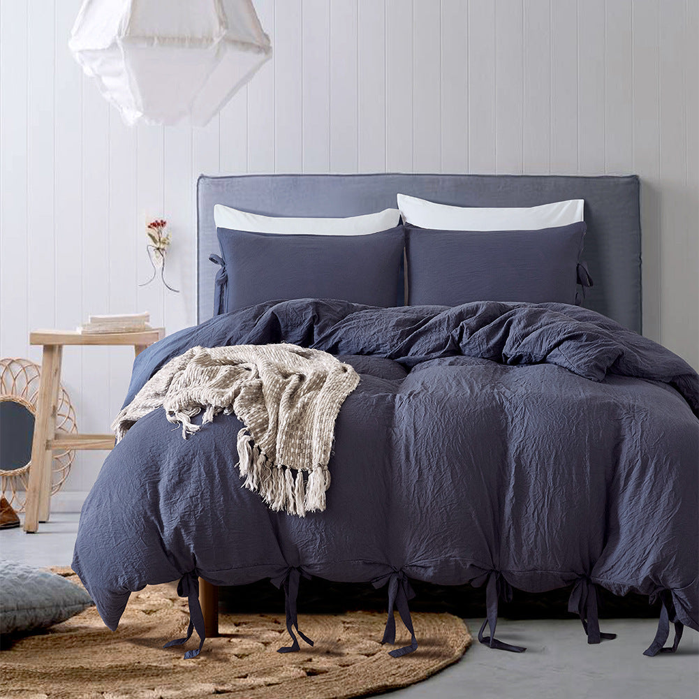 Aerial view of the VibeCore Aesthetic Knot So Ordinary Duvet Cover Set in navy blue, featuring a unique knot texture and soft, pastel color that adds a touch of modern charm and cozy elegance to your bedroom or dorm.

