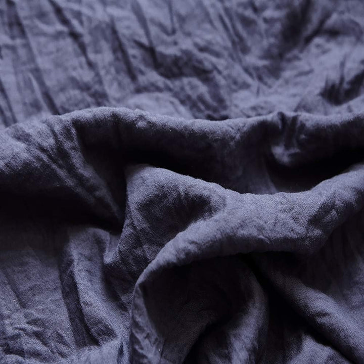 Close-up of the VibeCore Aesthetic Knot So Ordinary Duvet Cover Set in navy blue, showcasing the soft and textured material and vibrant pastel color, adding a cozy and stylish touch to your bedding.