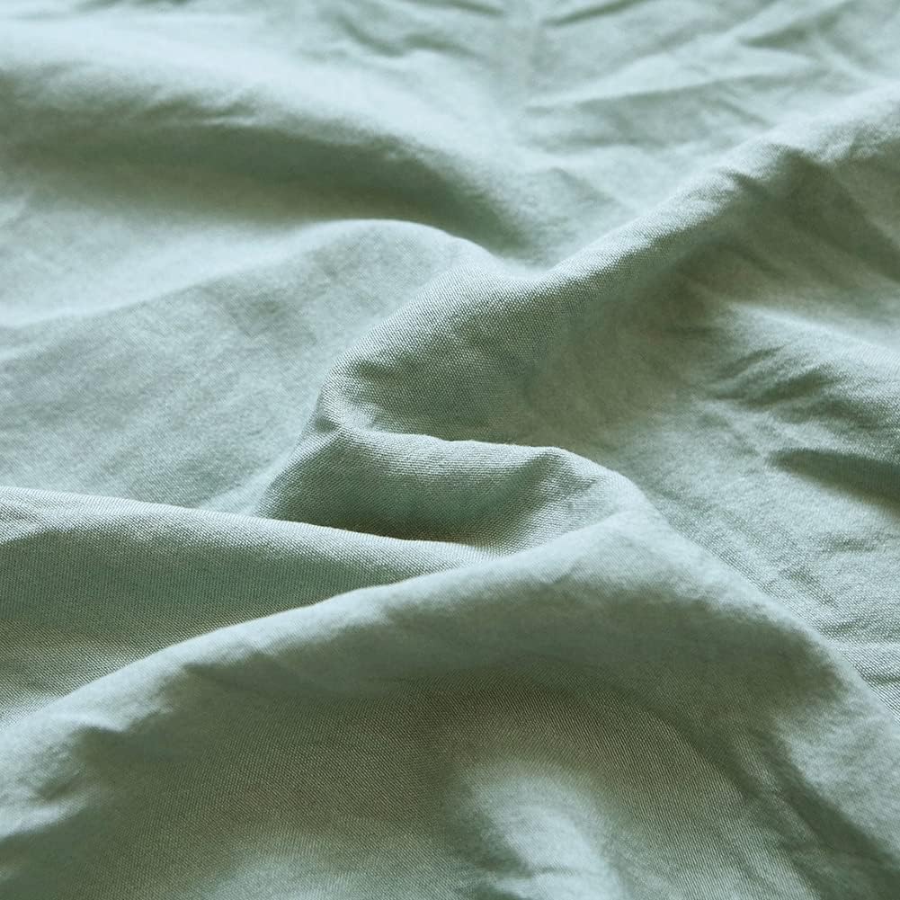 Close-up of the VibeCore Aesthetic Knot So Ordinary Duvet Cover Set in pastel green, showcasing the soft and textured material and vibrant pastel color, adding a cozy and stylish touch to your bedding.
