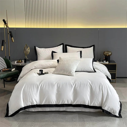 Aerial view of the VibeCore Aesthetic Luxe Noir Trim Duvet Cover Set, showcasing the elegant black trim that contrasts beautifully with the soft, luxurious fabric, bringing a modern and sophisticated touch to any bedroom or dorm decor.