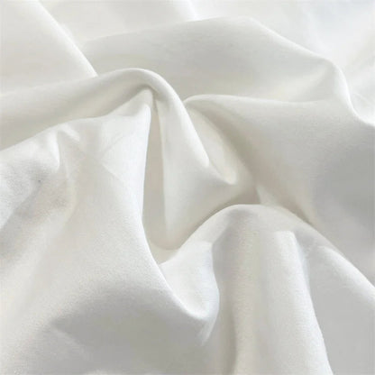 Close-up of the elegant fabric of the VibeCore Aesthetic Luxe Noir Trim Duvet Cover Set, showcasing its soft texture and sophisticated design with a contrasting black trim, perfect for adding a luxurious, modern touch to your bedroom or dorm decor.