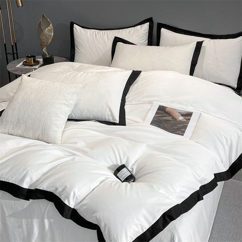 Top right view of the VibeCore Aesthetic Luxe Noir Trim Duvet Cover Set, highlighting the refined black trim details and smooth fabric, offering a sleek and luxurious design that elevates your bedroom or dorm aesthetic.