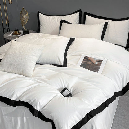 Top right view of the VibeCore Aesthetic Luxe Noir Trim Duvet Cover Set, highlighting the refined black trim details and smooth fabric, offering a sleek and luxurious design that elevates your bedroom or dorm aesthetic.