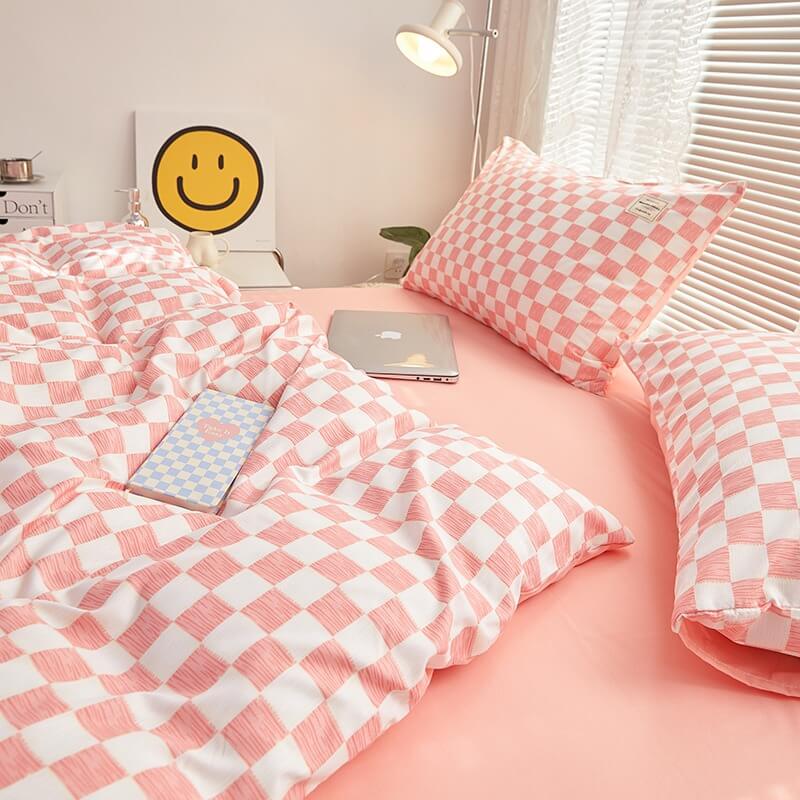 Close-up of the right side, demonstrating the checkered pattern on the 'VibeCore Mini Checkered Bedding Set' in Baby Pink. The modern, sleek design of the mini checkers enhances the stylish, cozy feel of the bedding, perfect for adding a fresh, contemporary vibe to your space.