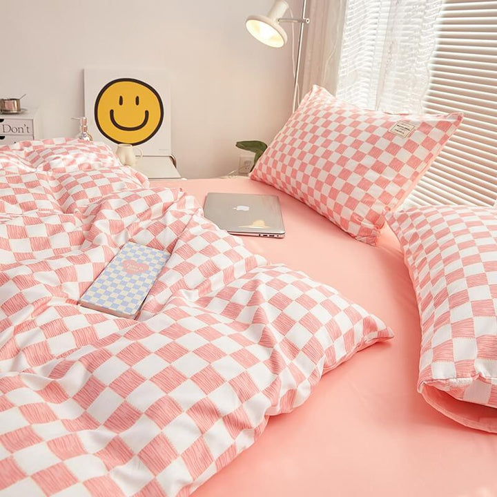 Close-up of the right side, demonstrating the checkered pattern on the 'VibeCore Mini Checkered Bedding Set' in Baby Pink. The modern, sleek design of the mini checkers enhances the stylish, cozy feel of the bedding, perfect for adding a fresh, contemporary vibe to your space.