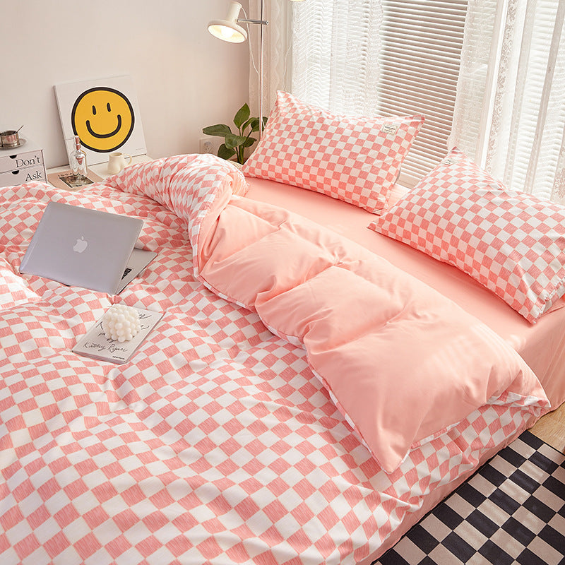 Close-up side view demonstrating the interior of the duvet cover and checkered pattern of the 'VibeCore Mini Checkered Bedding Set' in Baby Pink. The soft, high-quality fabric features a modern, sleek mini checkered design, adding a bold, contemporary touch to the cozy bedding.
