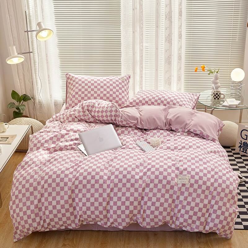 Aerial view of the 'VibeCore Aesthetic Mini Checkered Duvet Cover Set' in Lilac, showcasing the modern checkered pattern across the duvet cover and soft, high-quality fabric. The sleek design and fresh color create a chic, stylish atmosphere perfect for any bedroom or dorm.