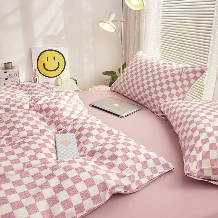 Close-up side view demonstrating the interior of the duvet cover and checkered pattern of the 'VibeCore Mini Checkered Bedding Set' in Lilac. The soft, high-quality fabric features a modern, sleek mini checkered design, adding a bold, contemporary touch to the cozy bedding.
