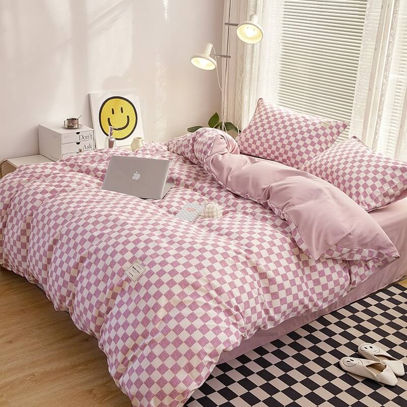 Right angle aerial view of the 'VibeCore Aesthetic Mini Checkered Duvet Cover Set' in Lilac, highlighting the modern checkered pattern and soft, durable fabric. The chic design and soothing lilac color add a fresh, contemporary touch to any bedroom or dorm.