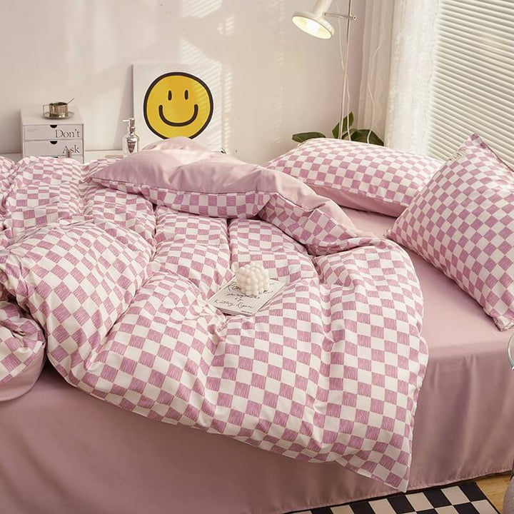 Side right view of the 'VibeCore Mini Checkered Bedding Set' in Lilac, showcasing the sleek, modern checkered pattern. The soft fabric and trendy design create a stylish and comfortable vibe, making it a perfect addition to any bedroom or dorm.