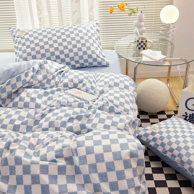 Close-up of the right side, demonstrating the checkered pattern on the 'VibeCore Mini Checkered Bedding Set' in Sky Blue. The modern, sleek design of the mini checkers enhances the stylish, cozy feel of the bedding, perfect for adding a fresh, contemporary vibe to your space.