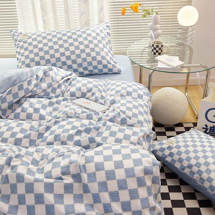 Close-up of the right side, demonstrating the checkered pattern on the 'VibeCore Mini Checkered Bedding Set' in Sky Blue. The modern, sleek design of the mini checkers enhances the stylish, cozy feel of the bedding, perfect for adding a fresh, contemporary vibe to your space.