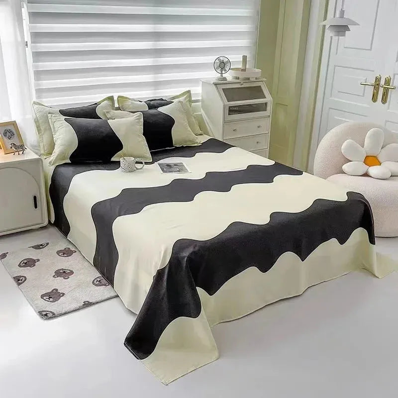 Aerial view of the VibeCore Aesthetic Monochrome Wave Duvet Cover Set, showcasing its bold black and white wave pattern on a soft, premium fabric, perfect for adding a modern, minimalist touch to any bedroom or dorm decor.